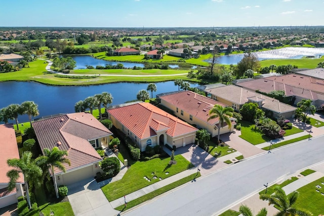 birds eye view of property featuring a residential view and a water view