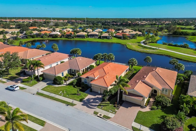 aerial view with a residential view and a water view