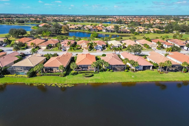 aerial view with a residential view and a water view