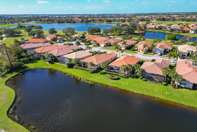 aerial view featuring a residential view and a water view