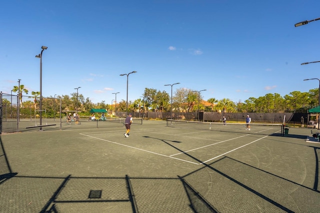 view of tennis court with fence