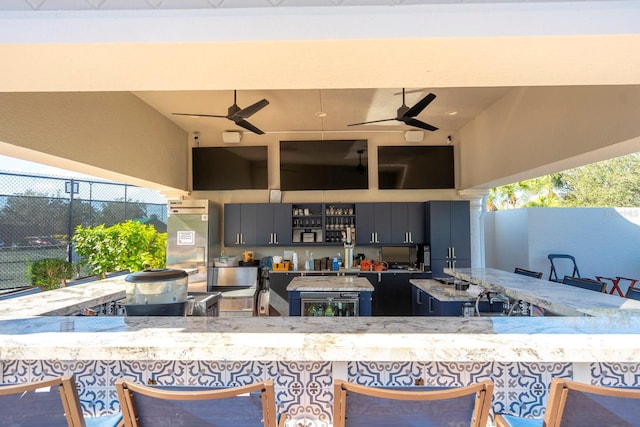 view of patio / terrace featuring ceiling fan, wine cooler, and fence