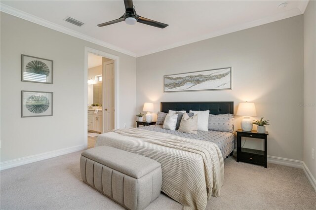 bedroom featuring light carpet, connected bathroom, ceiling fan, and crown molding