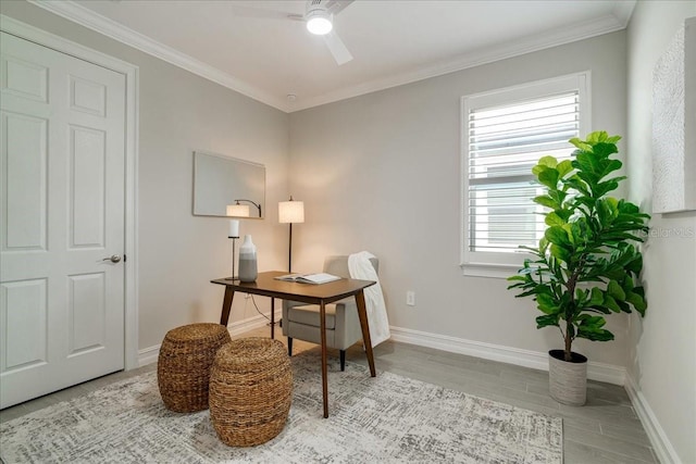 sitting room with ornamental molding, light wood-type flooring, and ceiling fan