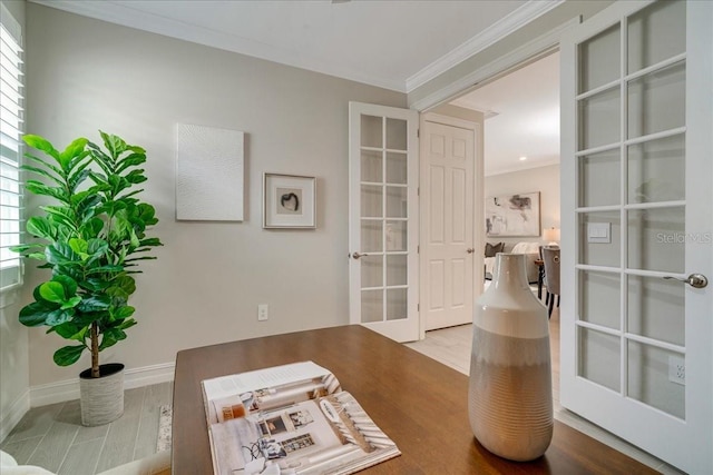 sitting room with crown molding and hardwood / wood-style floors