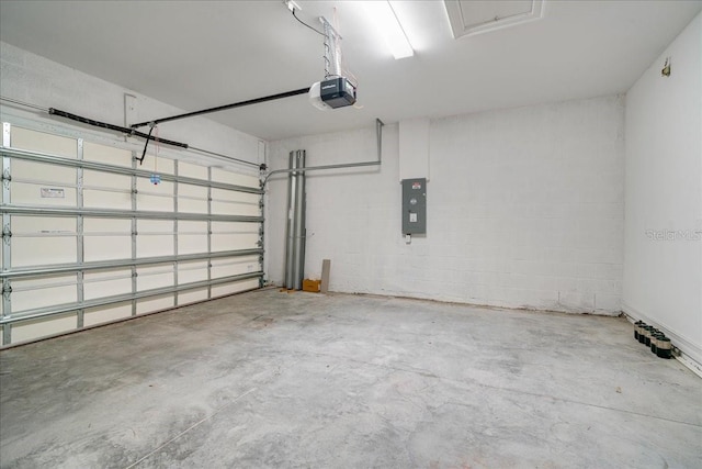 garage featuring a garage door opener and electric panel