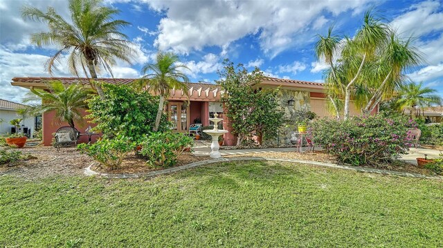 view of front of home with a front yard