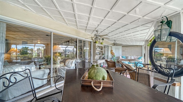 sunroom with ceiling fan and an outdoor hangout area