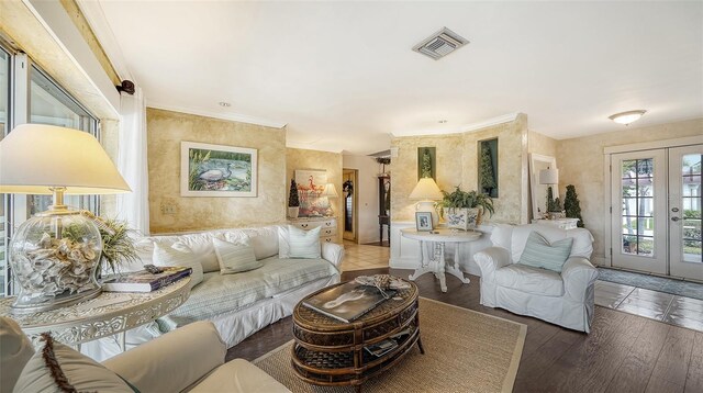 living room featuring french doors, hardwood / wood-style flooring, and ornamental molding