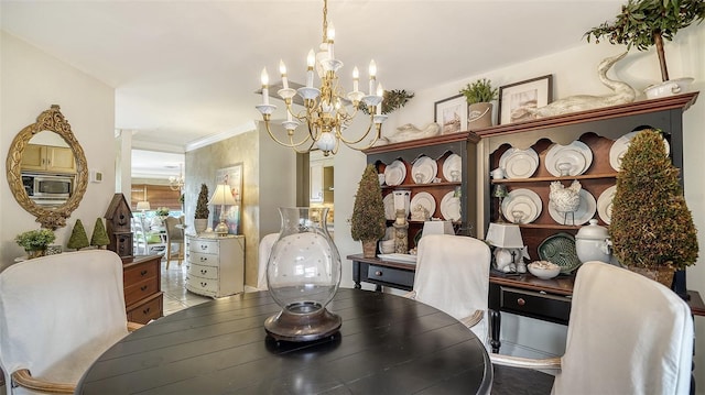 dining area featuring an inviting chandelier and crown molding