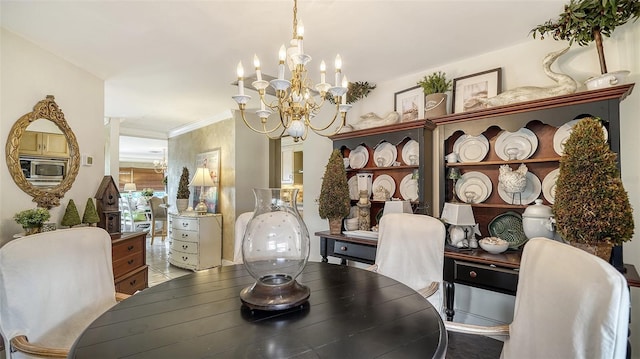 dining room featuring an inviting chandelier and crown molding