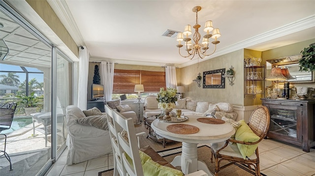 dining space with crown molding, an inviting chandelier, and light tile patterned floors