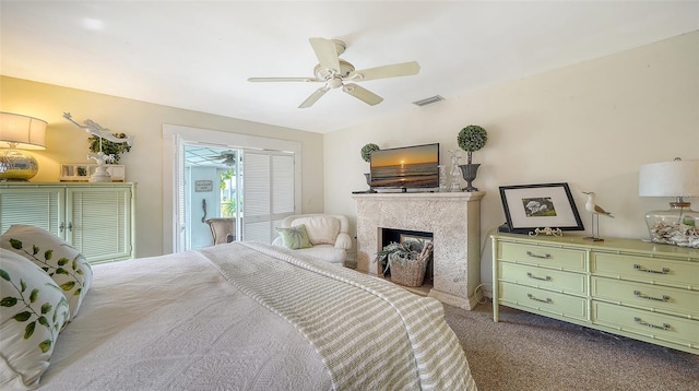 bedroom with light colored carpet, a closet, and ceiling fan