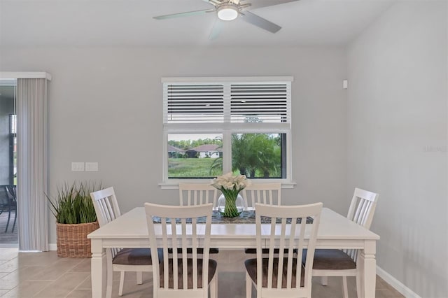 tiled dining area featuring ceiling fan