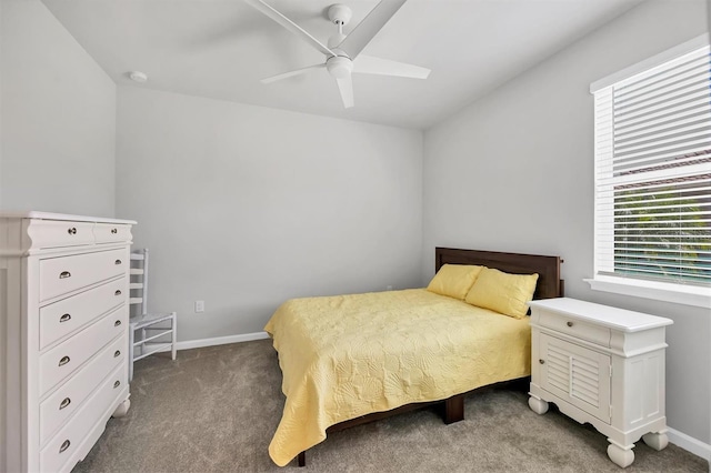 bedroom featuring dark colored carpet and ceiling fan