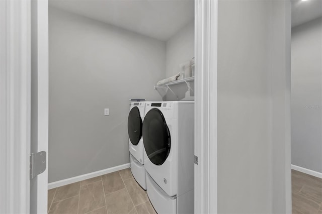 laundry room featuring separate washer and dryer