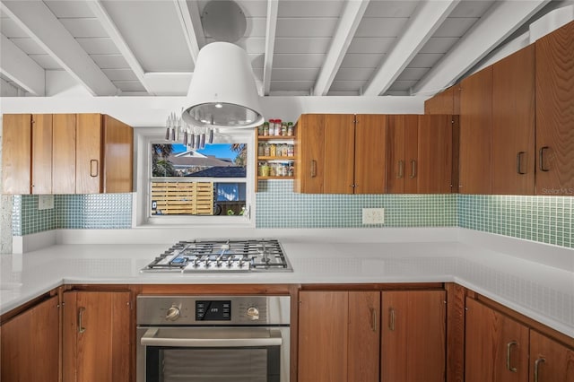 kitchen featuring beam ceiling and stainless steel appliances