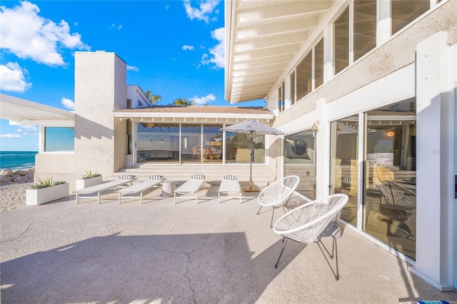 view of patio / terrace featuring a water view