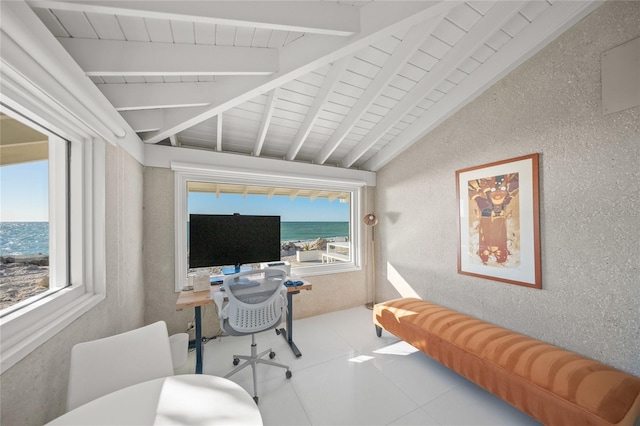 tiled office with vaulted ceiling with beams