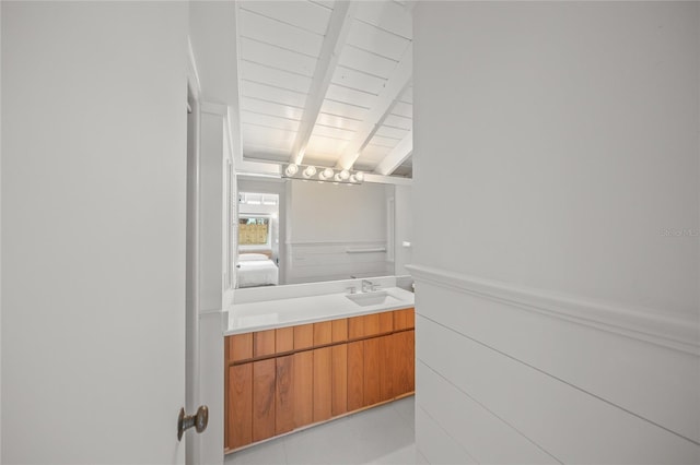 bathroom with vanity, vaulted ceiling with beams, and wooden ceiling