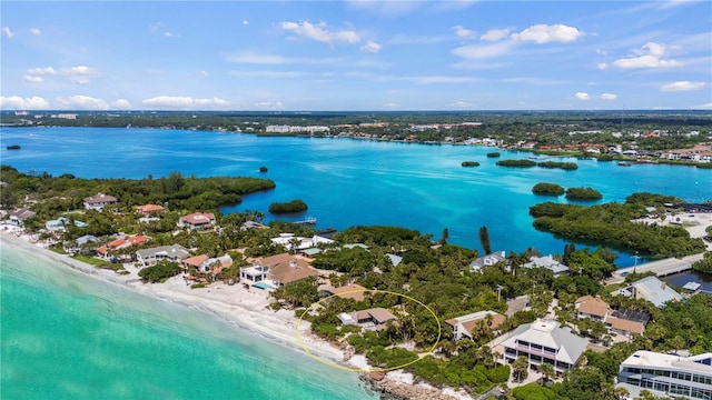 bird's eye view with a view of the beach and a water view