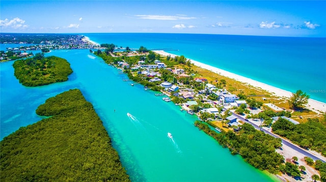 aerial view with a water view and a view of the beach