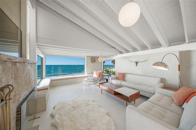 living room with wood ceiling, plenty of natural light, a water view, and lofted ceiling with beams