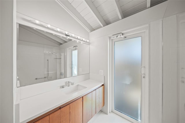 bathroom featuring vaulted ceiling with beams, a shower with door, and vanity