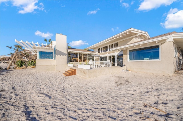 back of property featuring a patio area