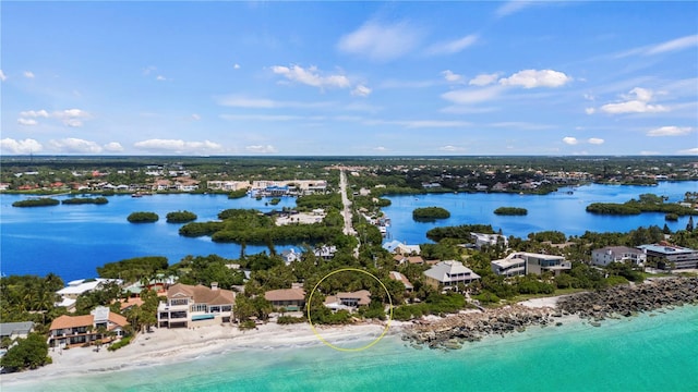 aerial view featuring a view of the beach and a water view