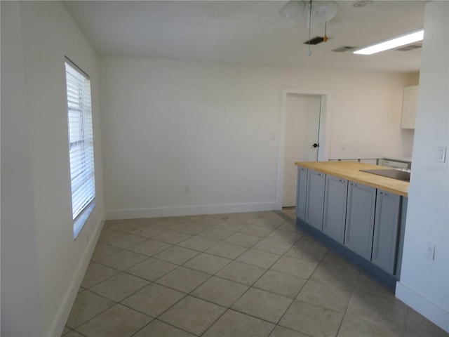 bathroom featuring tile patterned flooring and sink