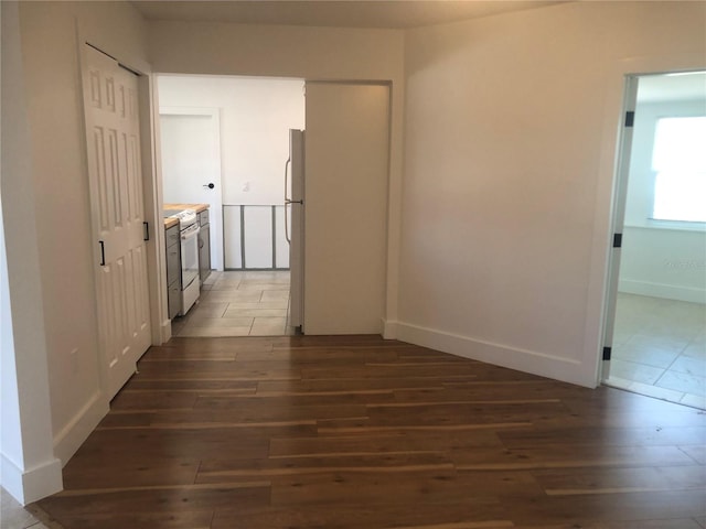 hallway featuring dark hardwood / wood-style floors