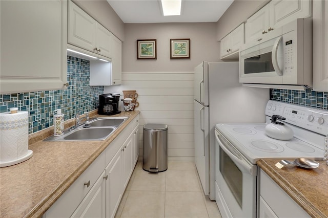 kitchen featuring white cabinets, white appliances, and decorative backsplash