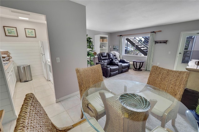 dining area featuring light tile patterned floors