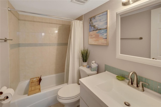 full bathroom with vanity, toilet, and shower / tub combo with curtain