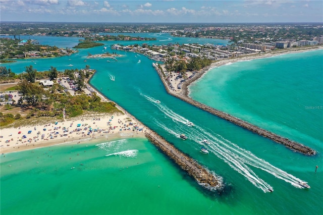 drone / aerial view featuring a view of the beach and a water view