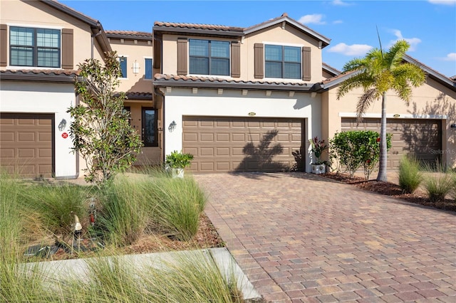 mediterranean / spanish-style home featuring a garage