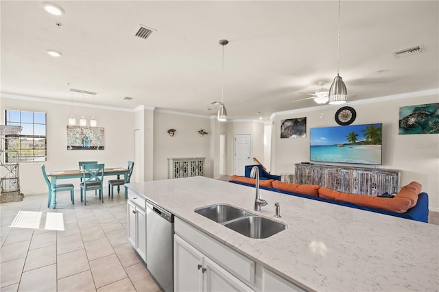 kitchen featuring pendant lighting, white cabinets, dishwasher, and sink