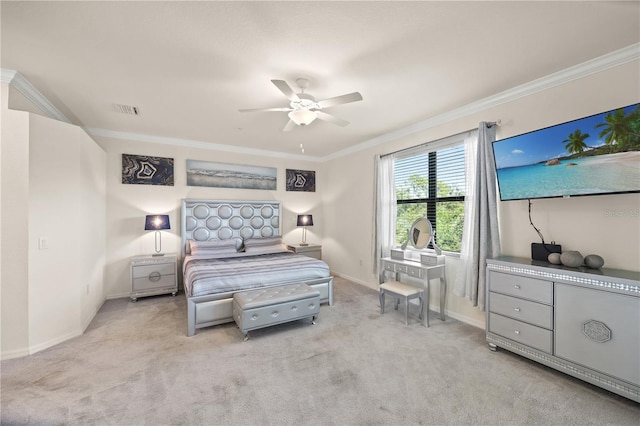 bedroom with ornamental molding, ceiling fan, and light colored carpet