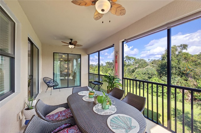 sunroom / solarium with ceiling fan