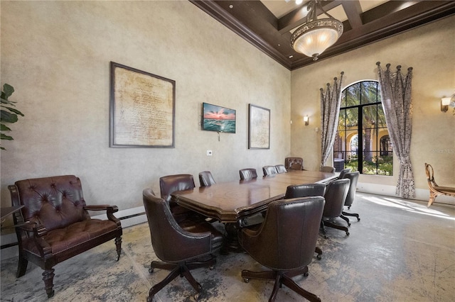 dining space featuring coffered ceiling, crown molding, beam ceiling, and a high ceiling