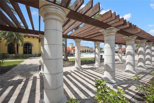 view of patio featuring a pergola and central AC unit