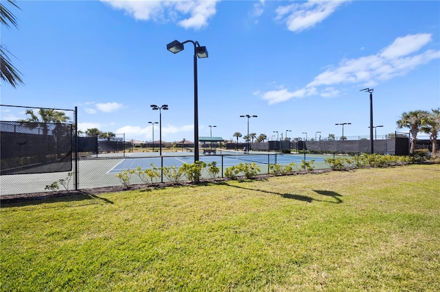 surrounding community featuring a lawn and tennis court