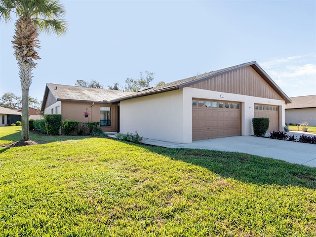 ranch-style home featuring a garage and a front yard