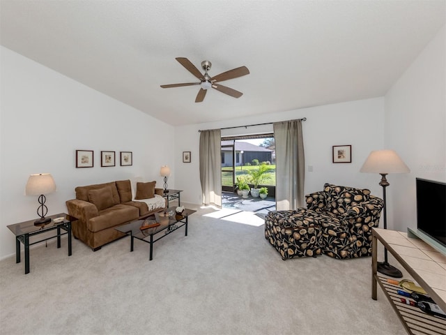 carpeted living room featuring ceiling fan