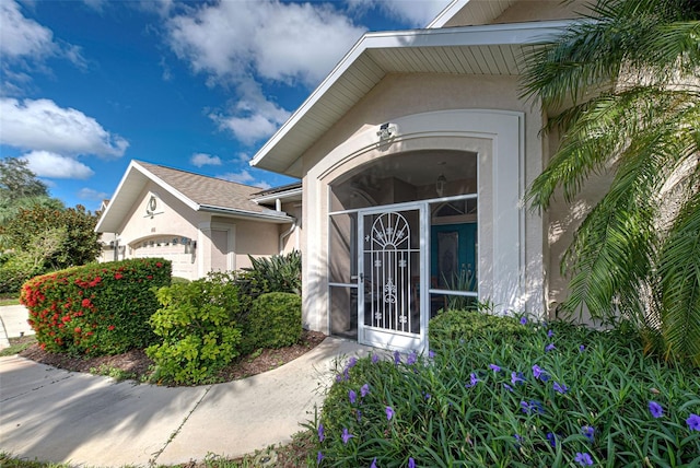 doorway to property featuring a garage