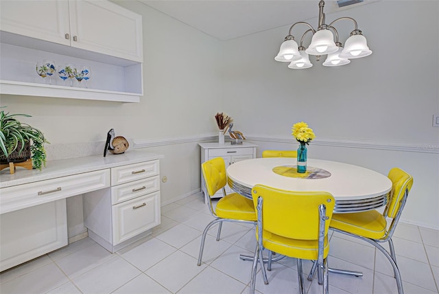 tiled dining room with a notable chandelier