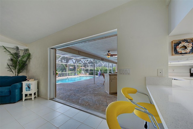 entryway featuring ceiling fan and light tile patterned floors