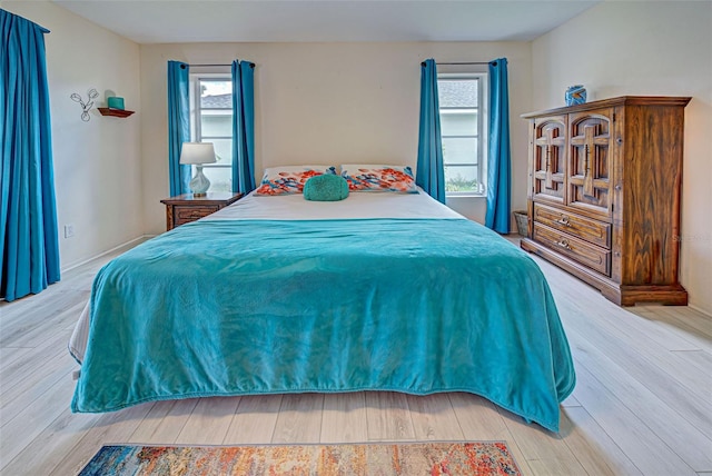 bedroom with light hardwood / wood-style floors