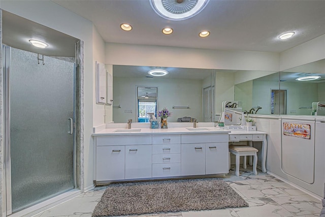 bathroom featuring vanity and a shower with shower door